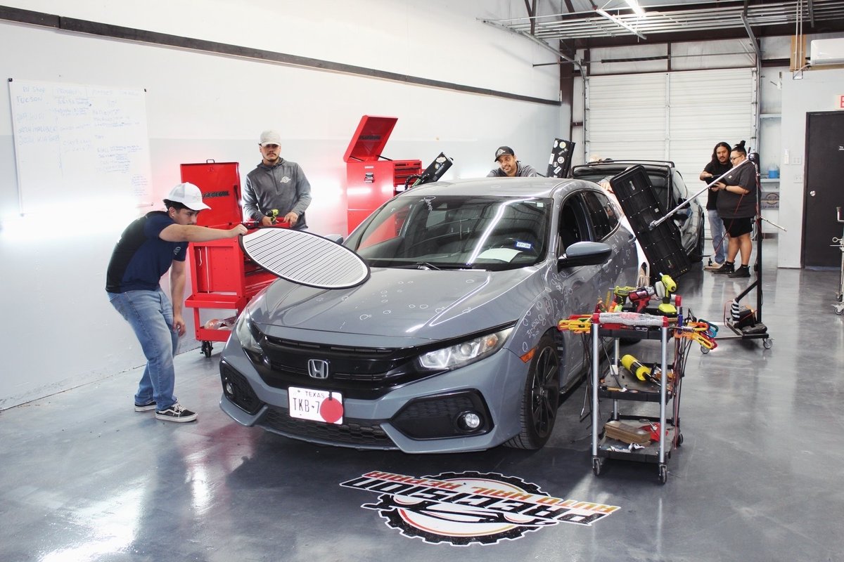 Precision Auto Hail Repair technician at work